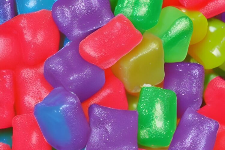 Colorful Gummy Sugar Candy Colorful gummy sugar candy is a type of candy that is made with gelatin, sugar, and various flavors and colors. It has a soft, chewy texture and is often shaped into fun and playful designs, such as bears, worms, or rings. The candy comes in a wide range of colors, from bright and bold hues like red, blue, and green, to more pastel shades like pink, yellow, and purple. Some gummy sugar candies are even multicolored or have a marbled appearance. When you bite into a piece of colorful gummy sugar candy, you'll typically experience a burst of fruity flavor, ranging from classic flavors like cherry, orange, and grape, to more unique tastes like pineapple, watermelon, and blue raspberry. Overall, colorful gummy sugar candy is a fun and delicious treat that appeals to both kids and adults alike. Its bright colors, playful shapes, and fruity flavors make it a popular choice for parties, movie nights, and anytime you want a sweet and chewy snack.